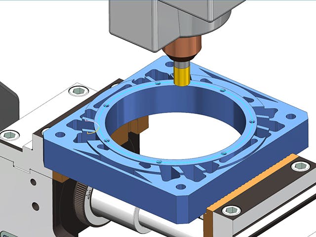 Siemens NX CAM simulation of an alternator face milling operation. The image shows a face mill tool machining the front surface of an alternator housing mounted on a rotary fixture. This highlights precision toolpath generation and verification in the NX CAM environment for complex part geometry.