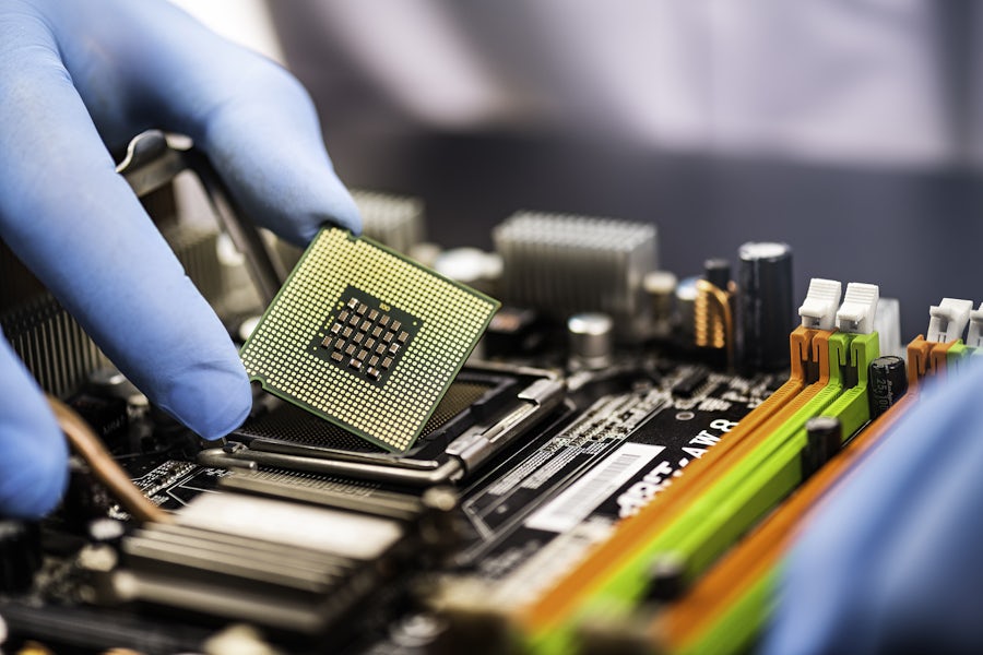 chip being placed in a socket on a board