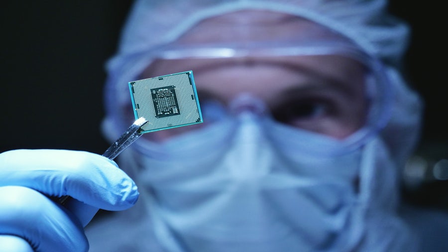 A scientist analyzing a semiconductor chip in a laboratory 