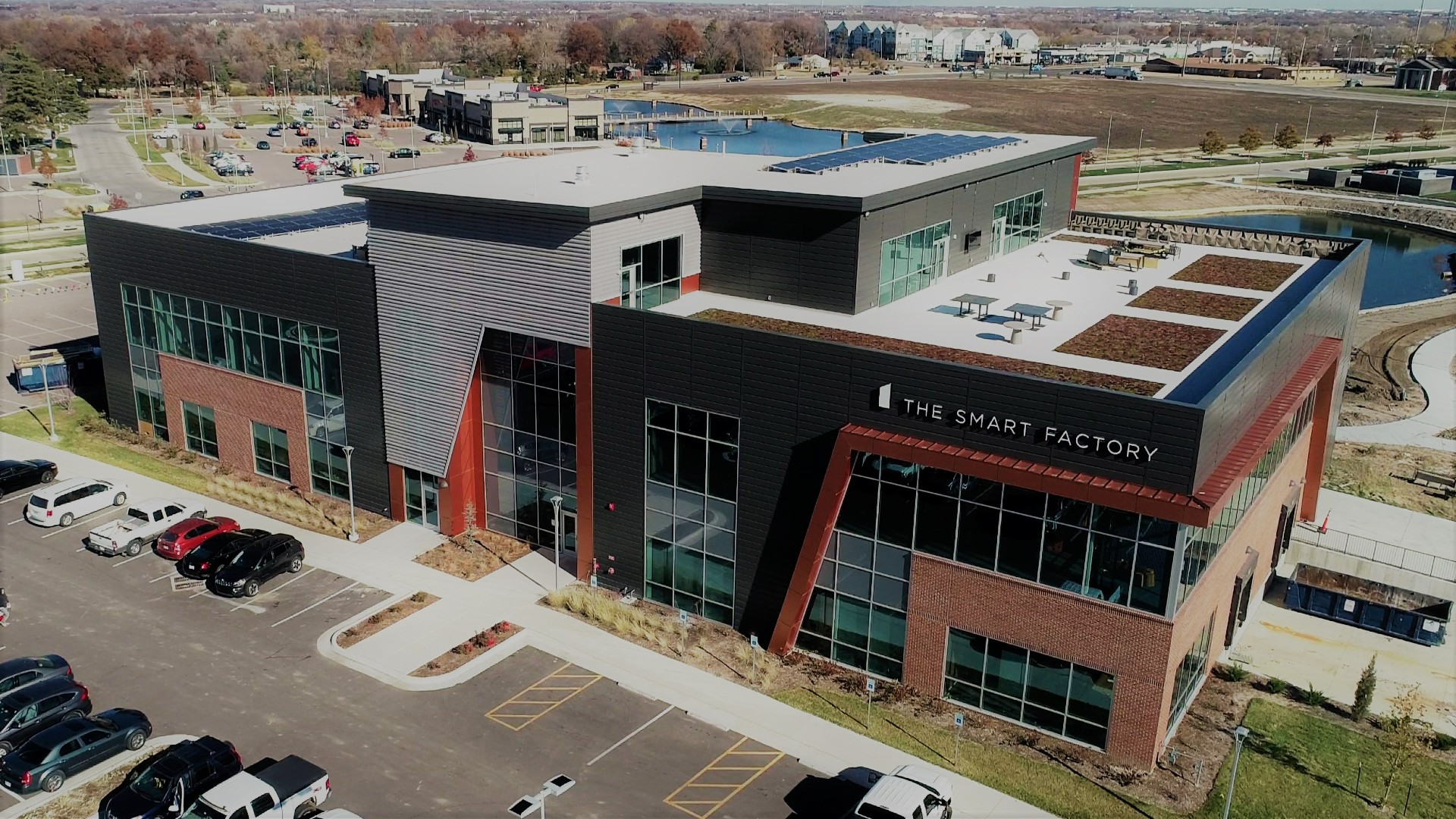 Outside view of a building with the words The Smart Factory on the building.