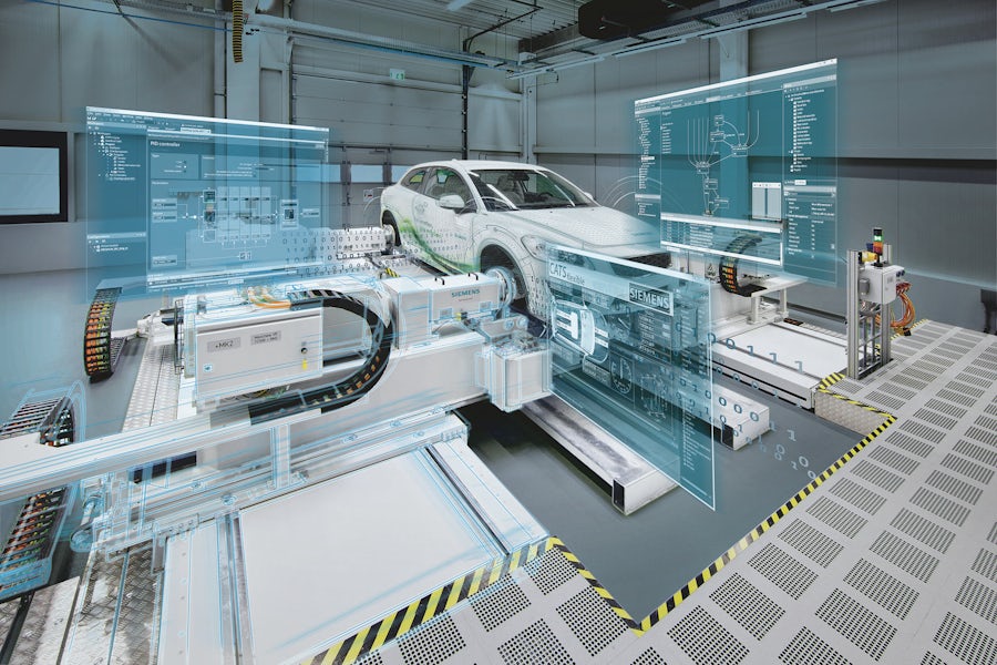 A white electric vehicle on a machine with digital translucent screens showing data superimposed around the vehicle.