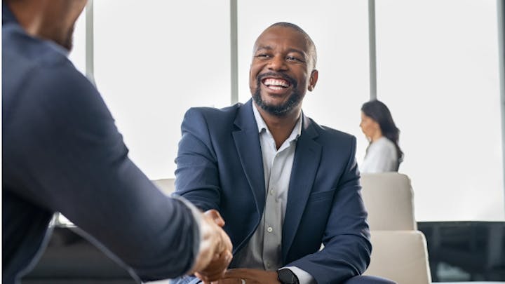 Two men shaking hands.