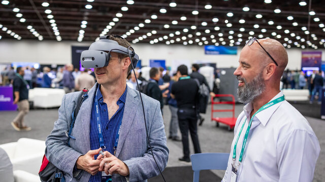 Customer interacting with an expert at a desk in the Solutions Center.