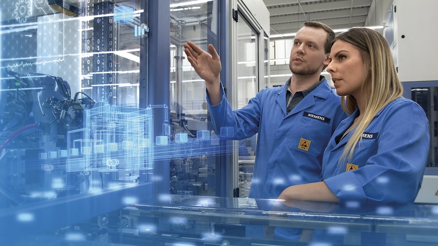 In a lab, a man is working with a women showing her something in the distance as they are surrounded by futuaristic blue lights and components.