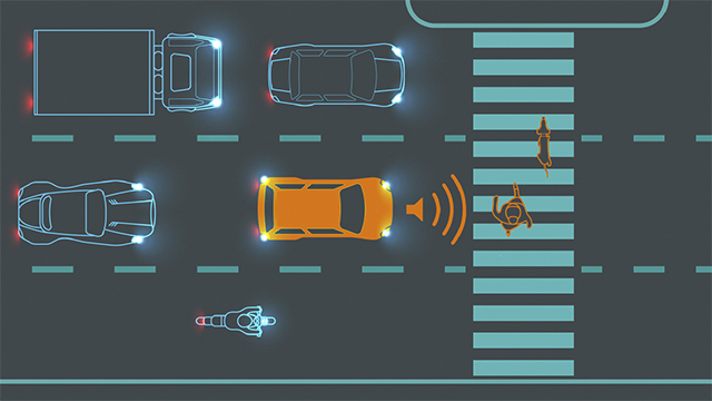 Diagramma che mostra un'auto sulle strisce pedonali che emette suoni per avvisare i pedoni della sua presenza.