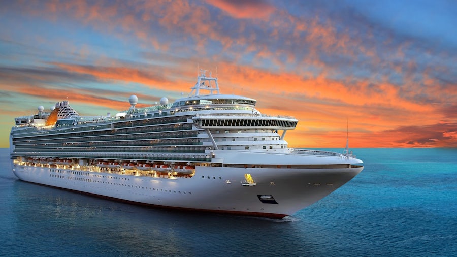 A large white cruise ship sails at sea