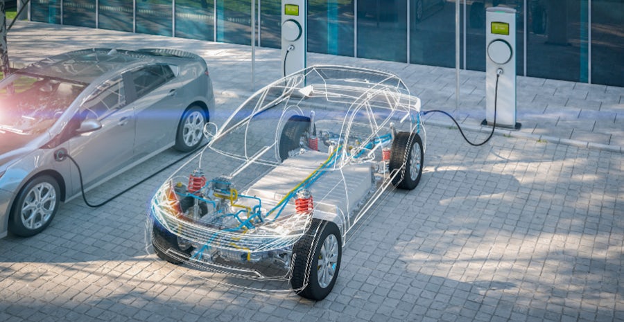 Electric vehicles plugged into a charging station, ready to recharge their batteries.