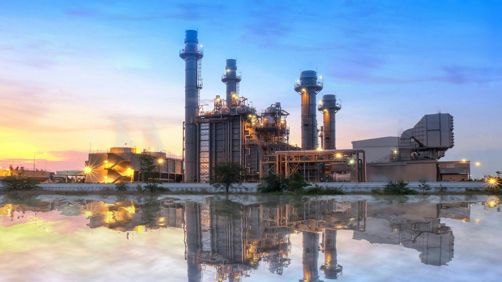 A powerplant from in front of the building in a wide frame showing the large size of the plant. 