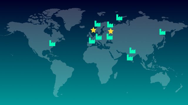 World map with icons representing Siemens plant locations and two star icons representing the best performing facilities.