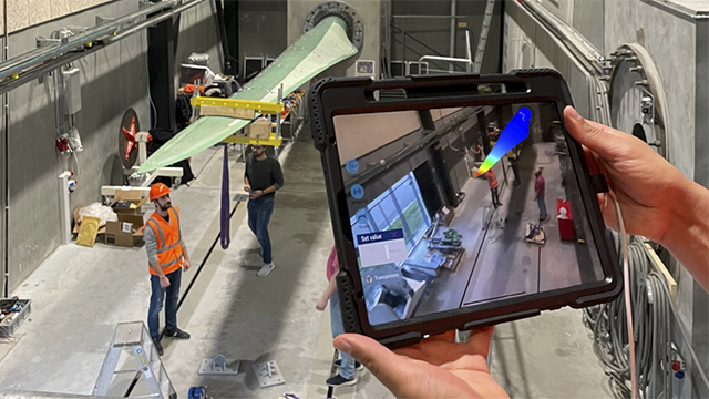 An executable digital twin calculating live stresses in a wind turbine blade fixed to a test rig.