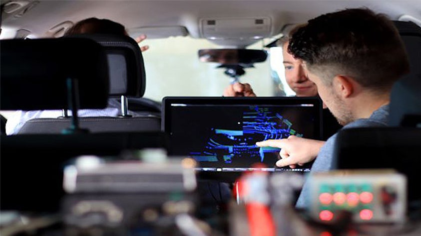 A couple of engineers validate a car's multi-sensor ADAS and autonomous drive systems.