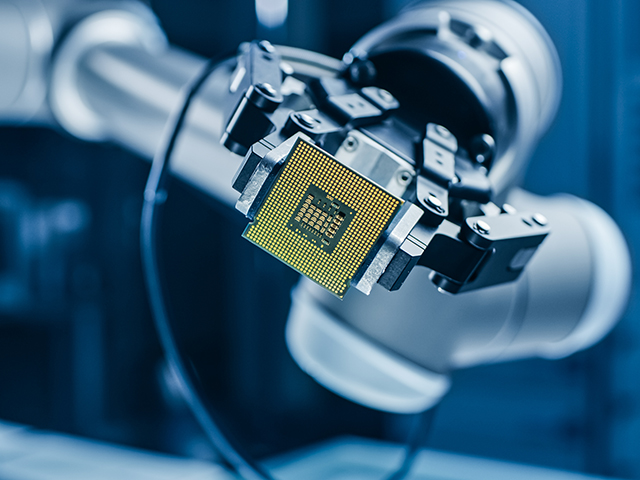 IC packaging design held by robotic arm