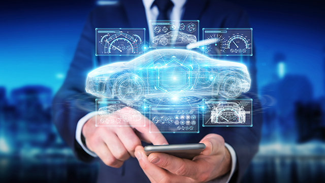 Man tapping phone with digital image of car schematic design and dashboard in front of him | The Calibre RealTime Digital interface enables on-demand immediate Calibre DRC feedback for digital design flows, enabling P&R engineers to shave weeks off their tapeout schedule.