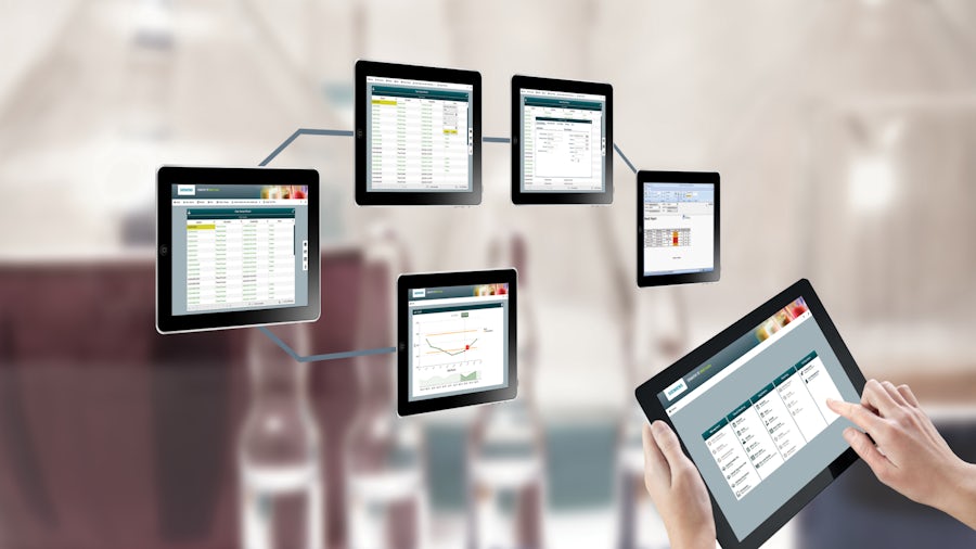 a wall full of tablets all featuring a different digital workspace, illustrating the agility and accessibility of cloud-native MOM