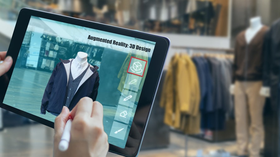 person holding ipad with 3d fashion design 