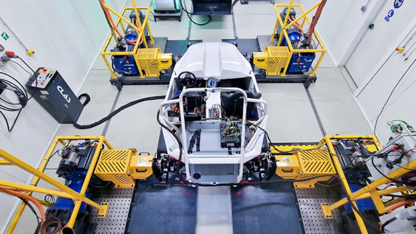 An electric vehicle in a lab for testing vehicle energy management (VEM) systems using Simcenter SCADAS RS for test data acquisition.