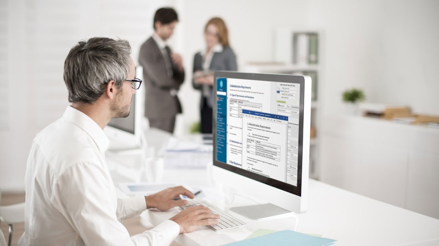 Man working and looking at a computer screen