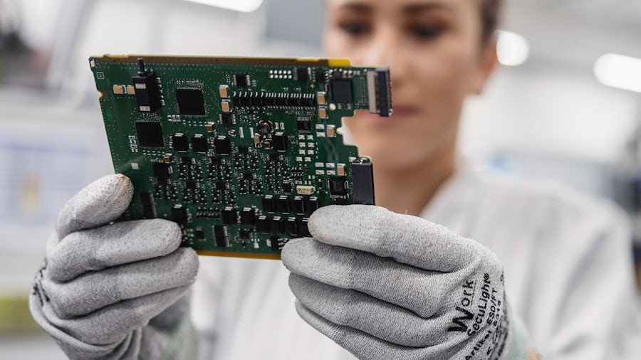 Female looking at a board with chips