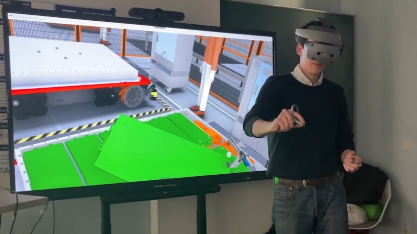 A student using an Immersive Engineering headset (Sony XR head-mounted display) with NX Immersive Designer software on a battery design.
