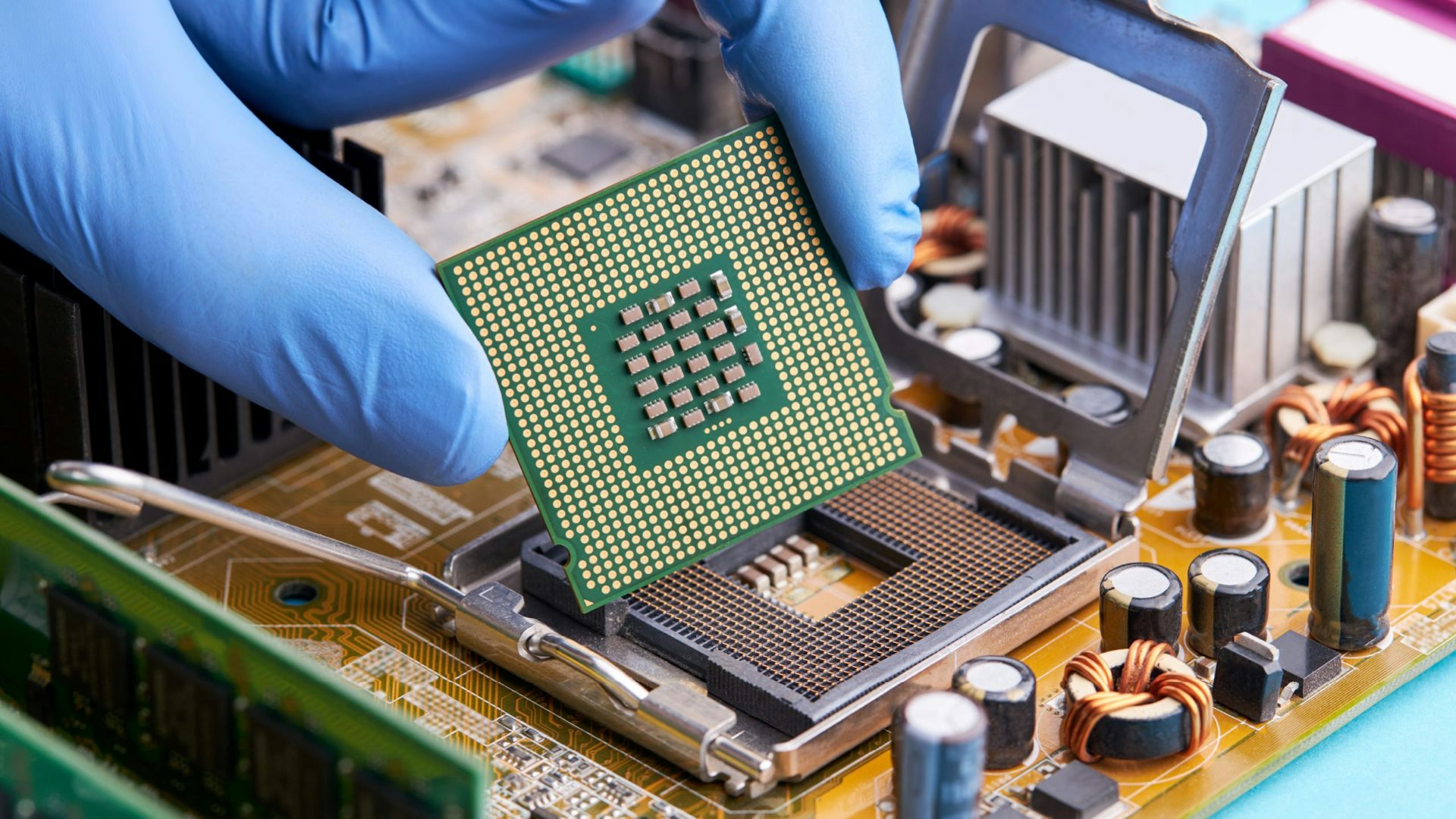 A hand holding a semiconductor.