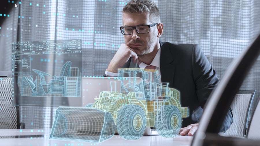 Uomo che lavora con il software per progettare attrezzature pesanti