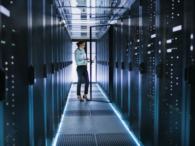 An engineer servicing a computer mainframe.