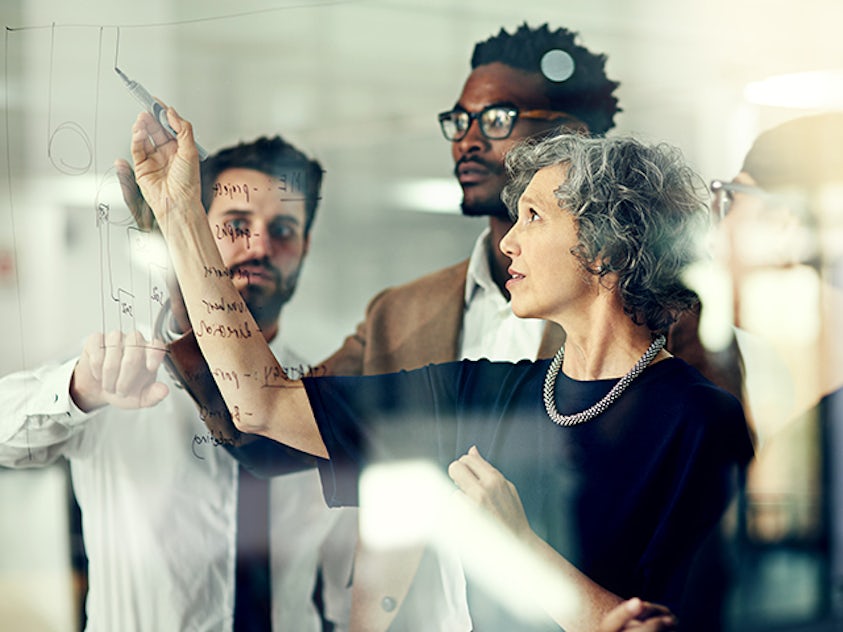 Product team evaluating risks for a product under development. Image conveys the concept of Failure Mode and Effects Analyis (FMEA).