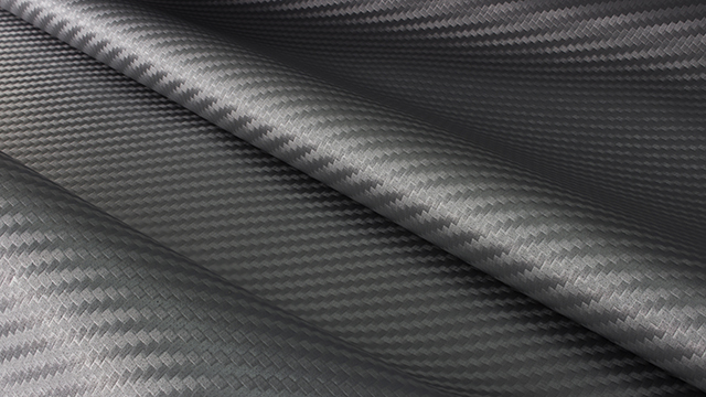 Fragmento de material de tejido de fibra de carbono.