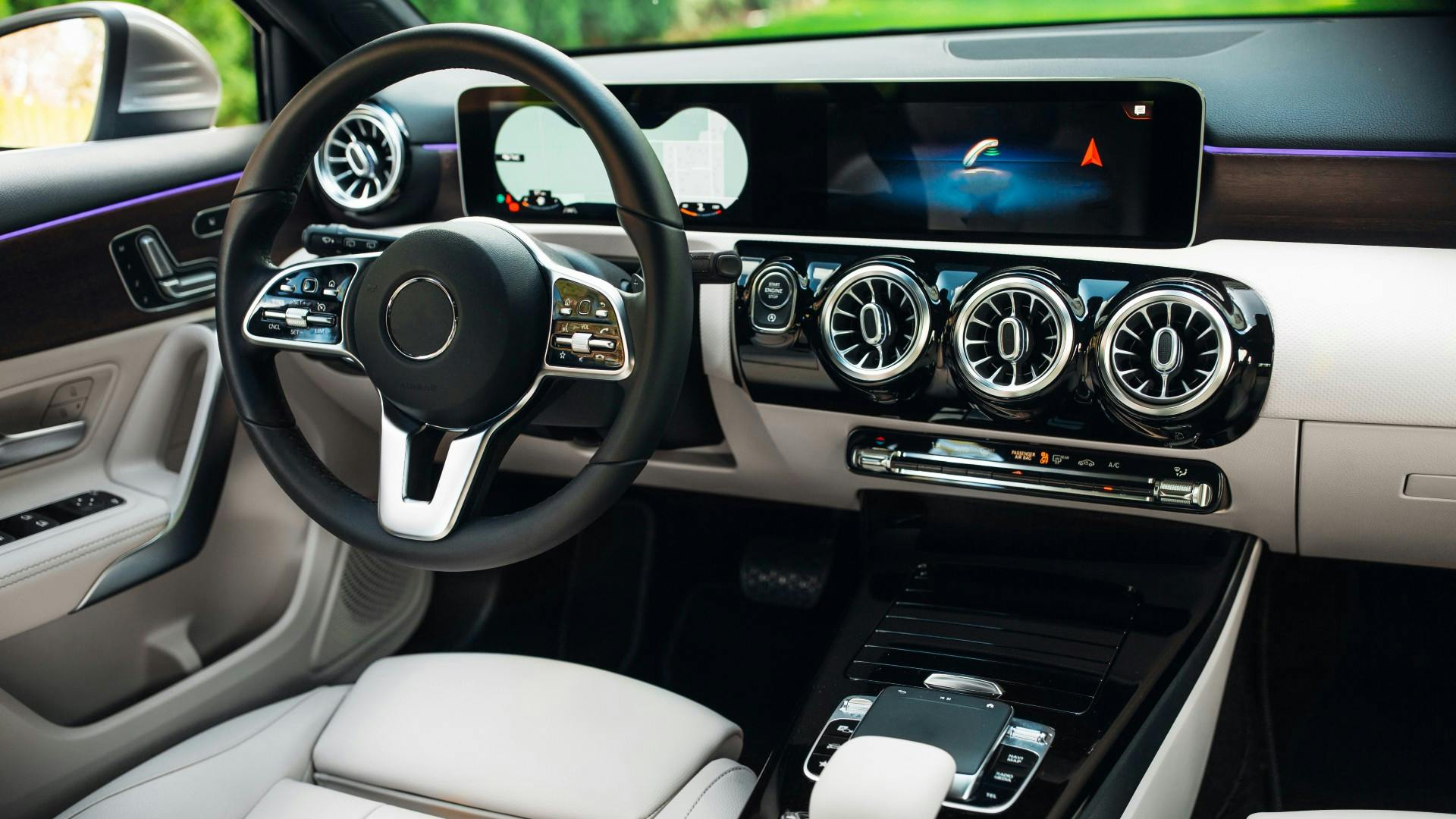 Interior of a software-defined vehicle that has features and functions primarily enabled through software on the dashboard display.