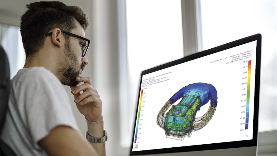 Engineer performing a thermal multiphysics simulation in Simcenter 3D on a computer.