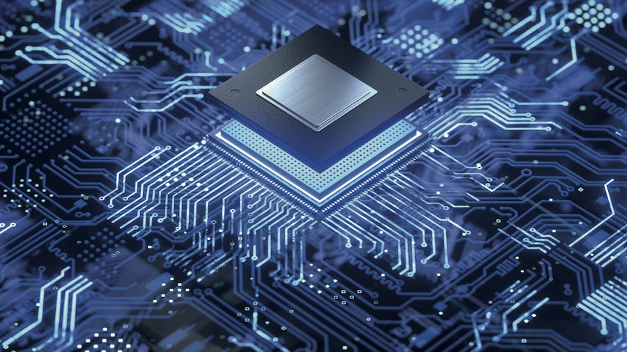 Fictionalized picture of an integrated circuit being placed on a printed circuit board. The background color is blue, while the IC and traces on the PCB are bright white