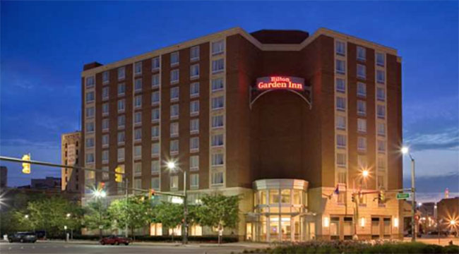 The Hilton Garden Inn building at sunset.