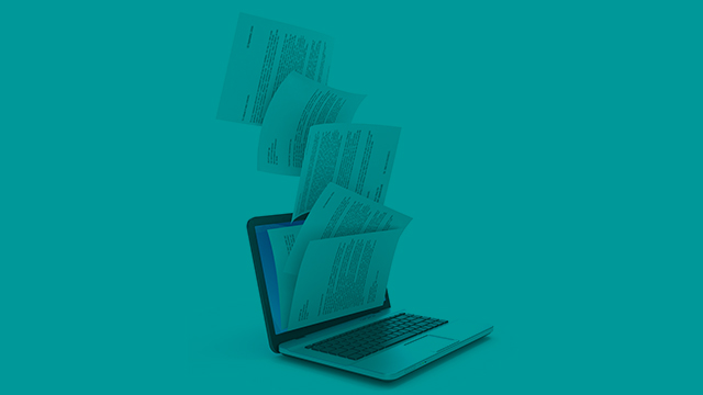 Image of paper coming out of a computer indicating a download of information