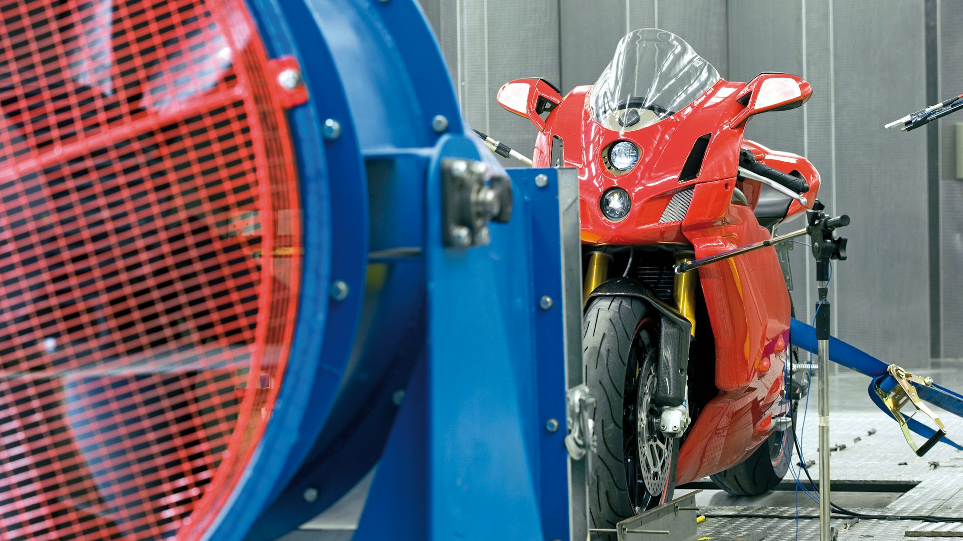 A motorcycle being tested in a wind tunnel.
