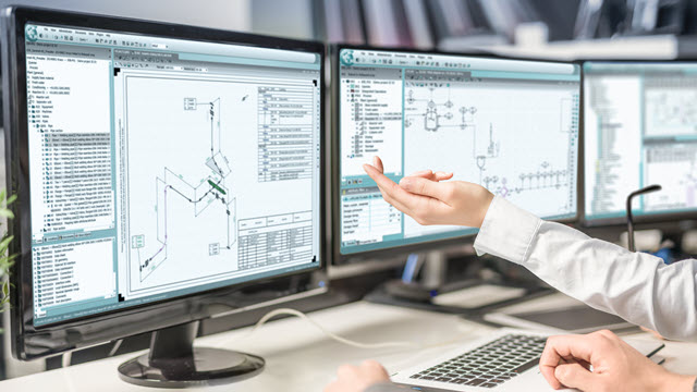 Three monitors showing design while an engineer is pointing fingers to show to another one