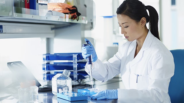 Lady performing testing in laboratory setting