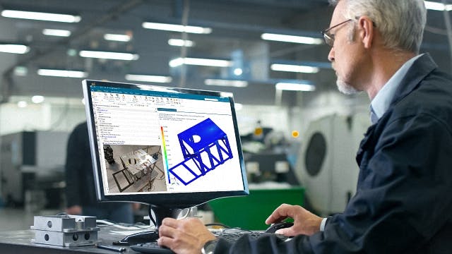 An engineer uses Simcenter simulation software to test for durability and strength in an industrial machine