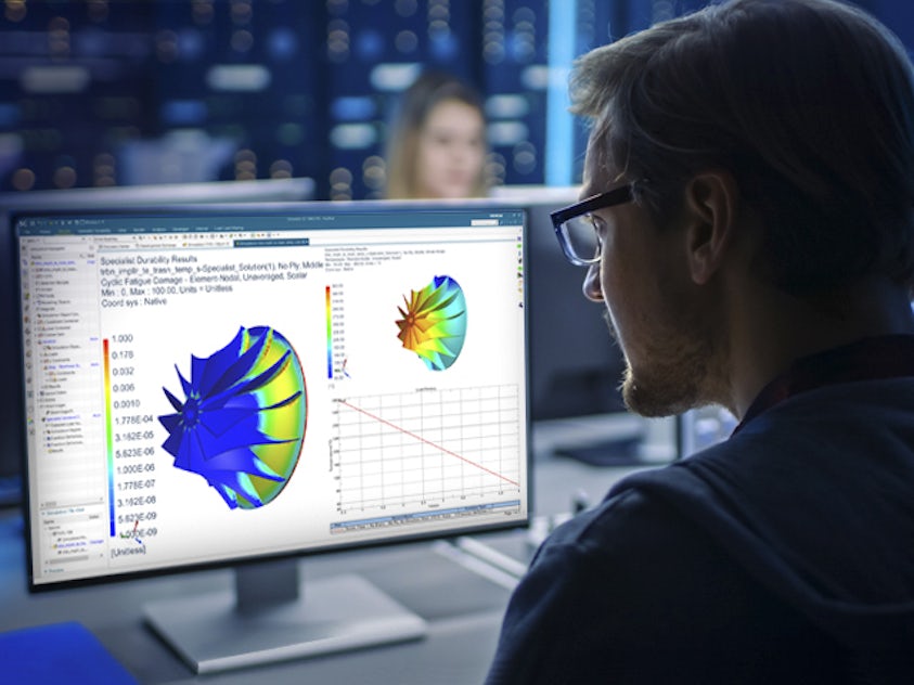 An engineer using the Simcenter 3D software for computer-aided engineering (CAE).