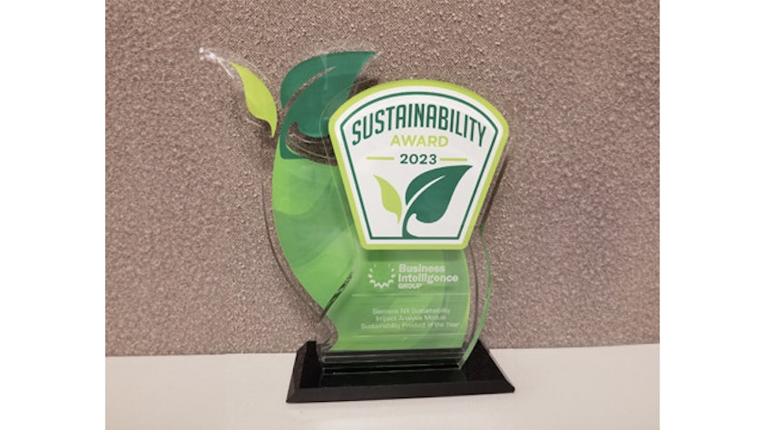 A 2023 Sustainability award that looks like a beanstalk with two leaves; on a desk that reads 'Siemens NX Sustainability Impact Analysis Module, Sustainable Product of the Year' from the Business Intelligence Group
