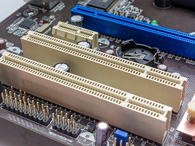 A pc motherboard with PCIe connectors.