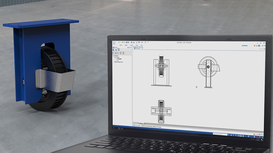 A caster for a cart sitting on a table next to a laptop monitor depicting the 2D CAD drawing of the caster.