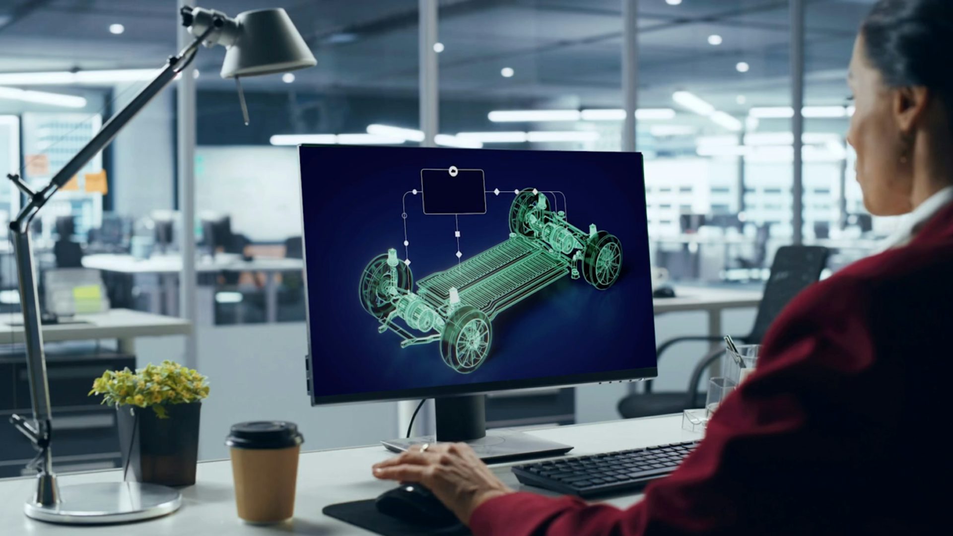 An engineer works on edrive systems using electric vehicle simulation software.