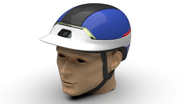 A high quality rendering in NX of a mannequin head wearing a bike helmet that was designed in NX.
