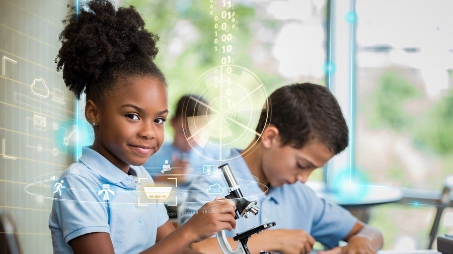 Children engaging in science education with a microscope