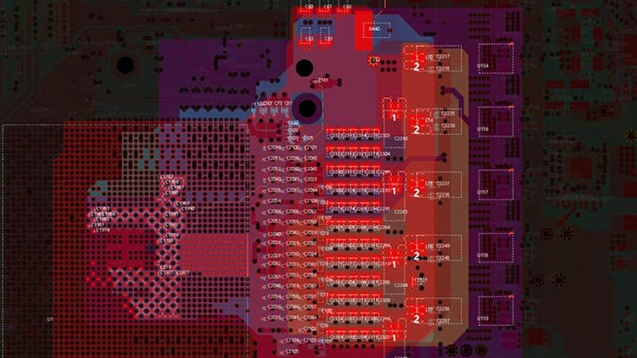 Professional with tablet overlooking manufacturing facility floor