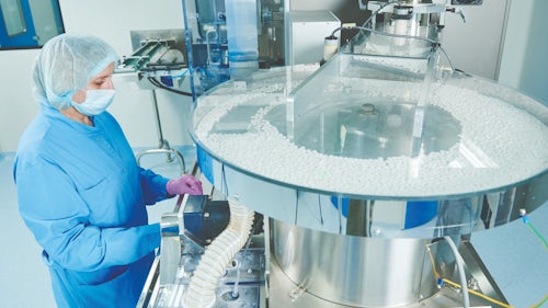 Pharmaceutical industry worker in a manufacturing facility