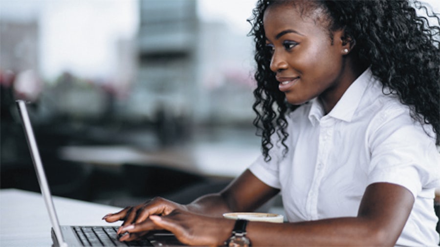 Woman typing on laptop