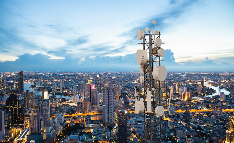 5G tower over large city