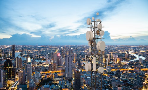 5G tower over large city