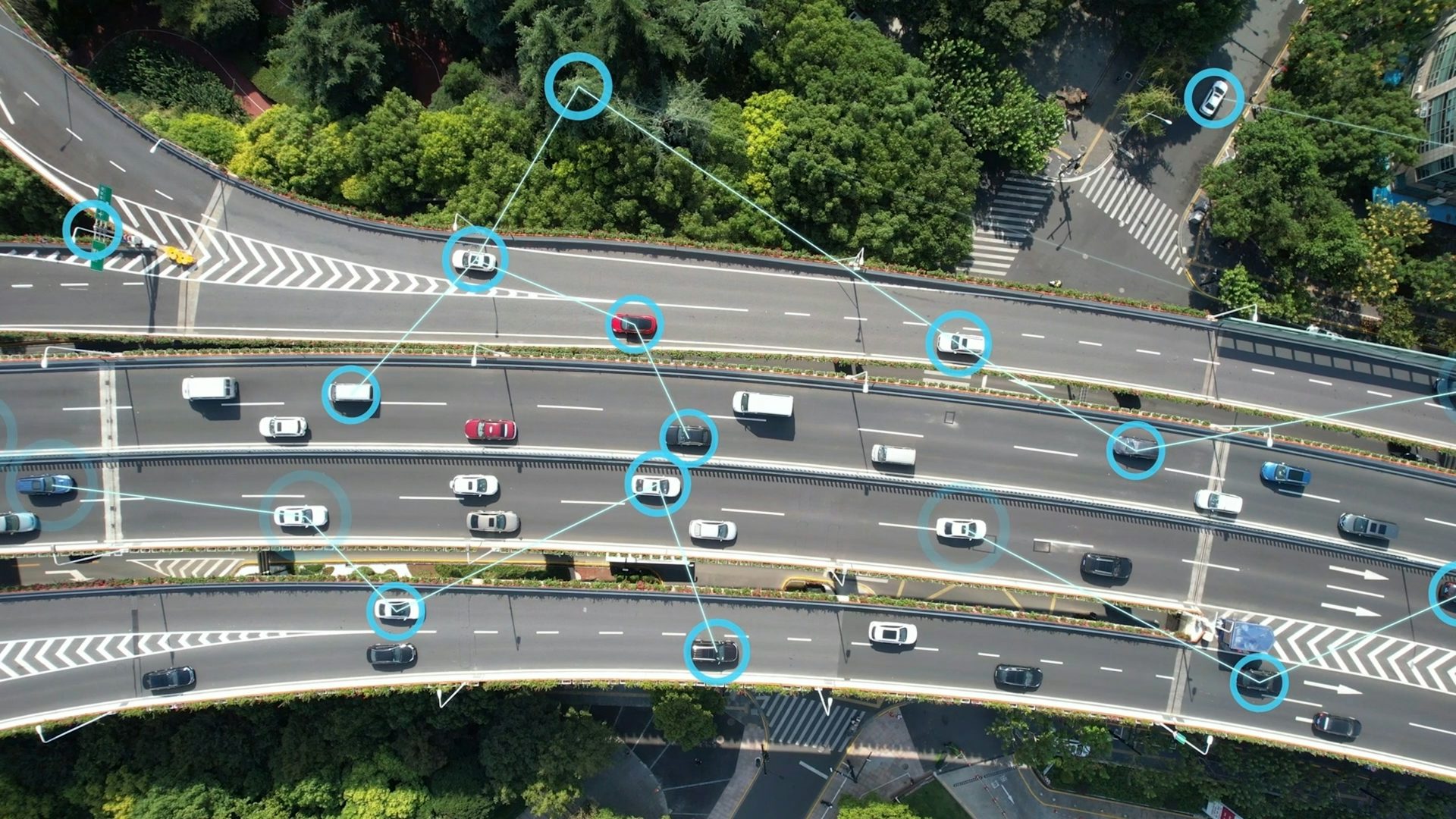 Sky view of cars on a freeway with graphic circles around some cars, and lines connecting those circles